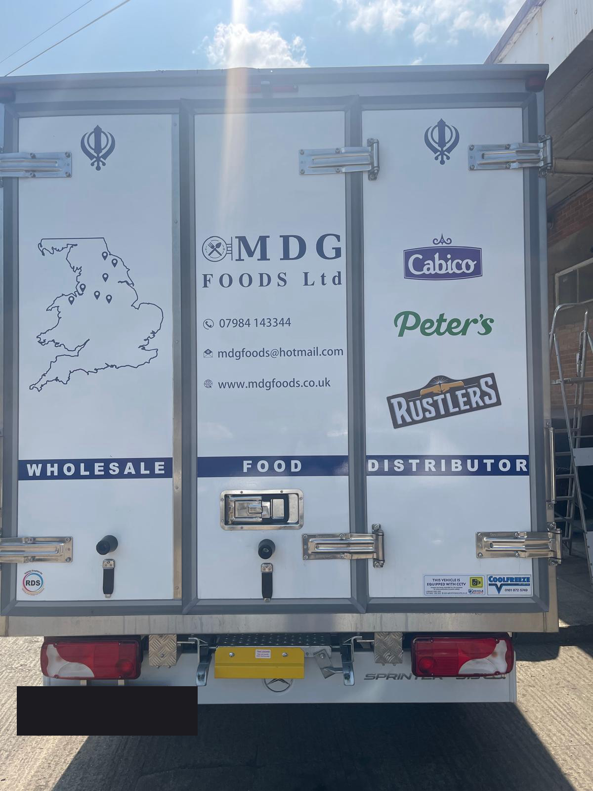 MDG Foods box truck with brand partners
